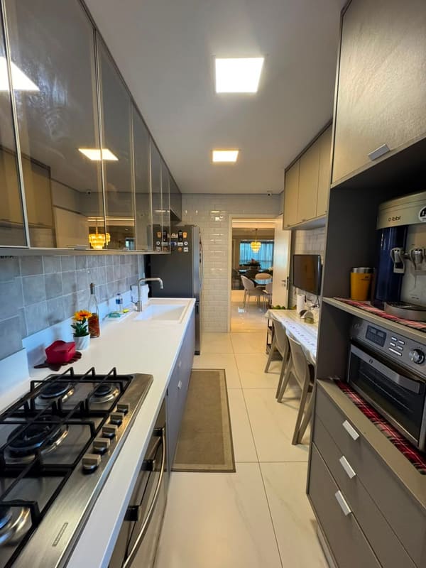 Kitchen with gas cooktop and built-in ovens