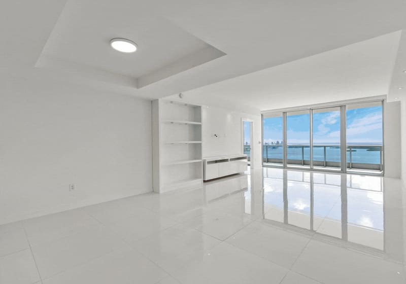 Living room with floor-to-ceiling glass facing the bay