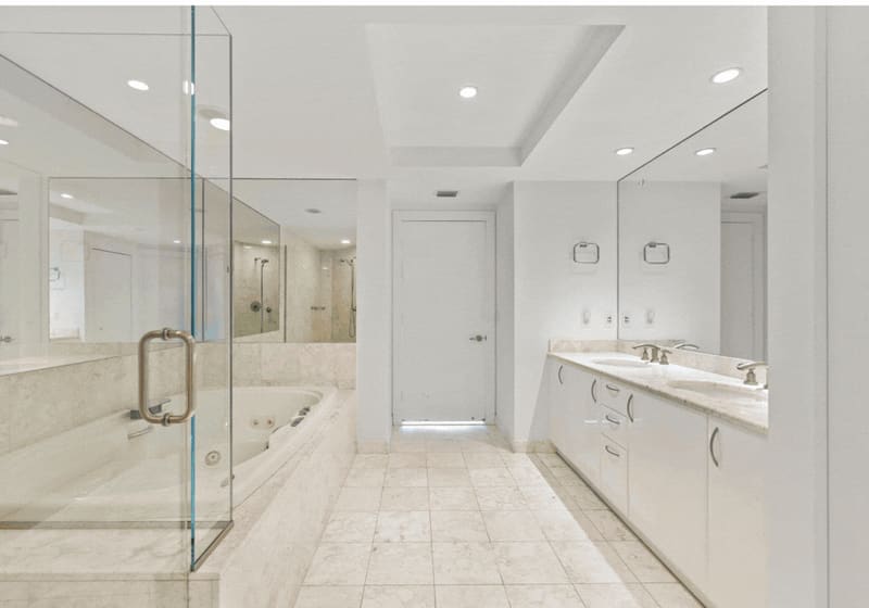 Primary bathroom with glass shower and soaking tub