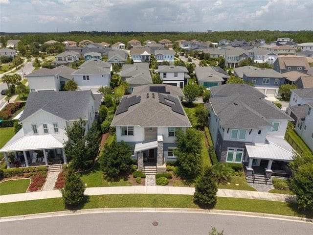 Aerial view of the home and the park across the street