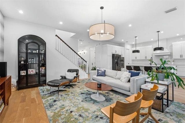 Living area with the staircase and built-in cabinet