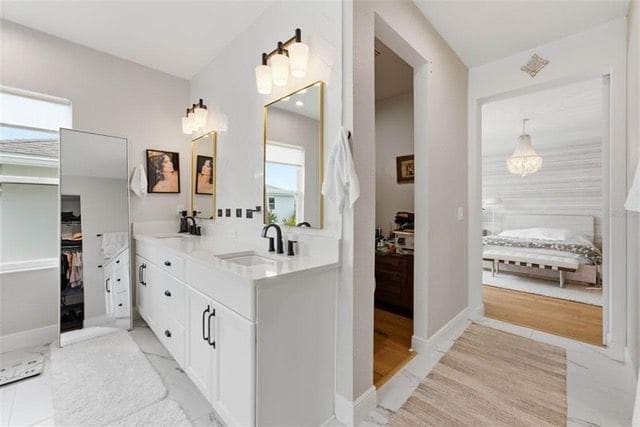 Primary vanity leading to the walk-in closets